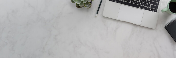 Canvas Print - overhead shot of workspace with laptop, stationery and copy space on marble desk