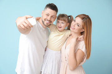 Poster - Family taking selfie on color background