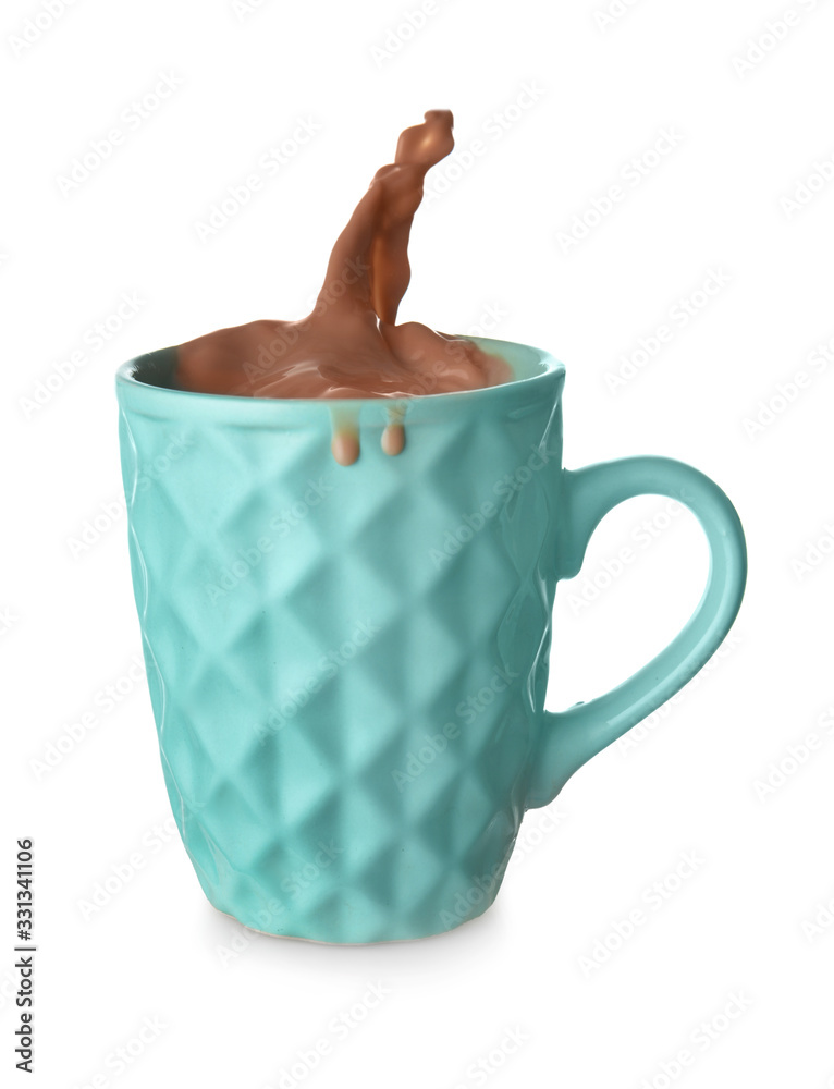 Cup with splashing cocoa drink isolated on white