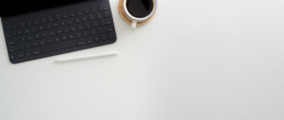 Canvas Print - top view of simple workspace with digital tablet, stylus, coffee cup