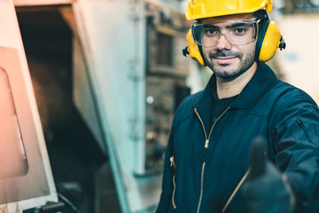 Wall Mural - Industrial Engineers in Hard Hats.Work at the Heavy Industry Manufacturing Factory.industrial worker indoors in factory. man working in an industrial factory.