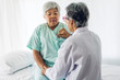 © Art_Photo - Female senior doctor consulting and examining senior woman patient with stethoscope in hospital.healthcare and medicine