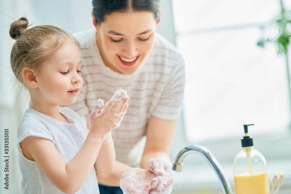 girl and her mother are washing hands - obrazy, fototapety, plakaty 