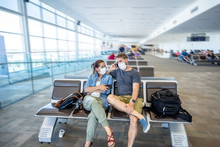 Coronavirus Outbreak Travel Restrictions. Traveler With Mask At Airport Affected By The Travel Ban And Flights Cancellations And Border Shutdowns.