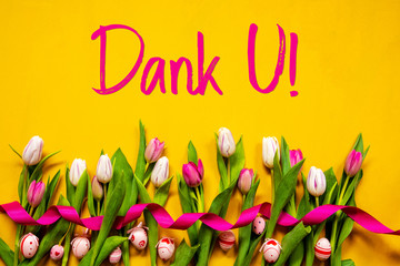  Dutch Text Dank U Means Thank You. White And Pink Tulip Spring Flowers With Ribbon And Easter Egg Decoration. Yellow Wooden Background