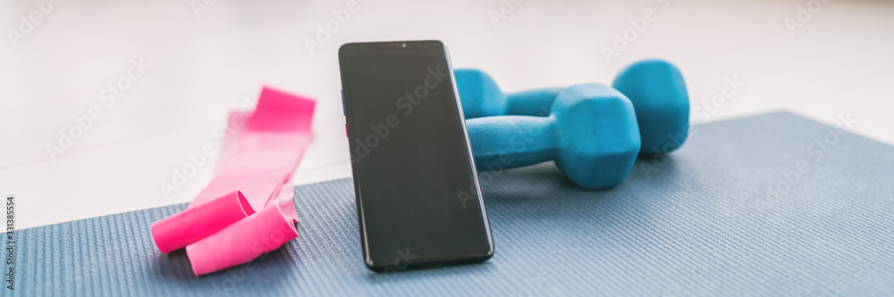Fitness at home online workout on phone app for training inside with dumbbell weights and resistance bands banner background. - obrazy, fototapety, plakaty 