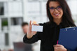 © H_Ko - Female arm give blank calling card to visitor closeup. White collar colleagues company name exchange job interview sale clerk id executive or ceo finance support formal identity concept