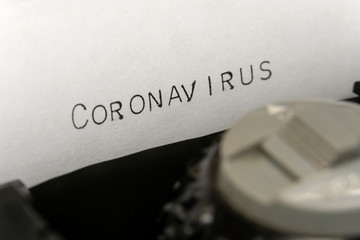 Wall Mural - Close up printed text Coronavirus on an old typewriter