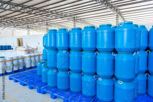 Fotomural Blue Plastic barrels contain in factory