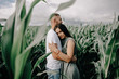 © olegzaicev - Couple walking through corn maze.
