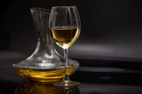 Fototapeta Lawenda - A glass full of wine and wine decanters