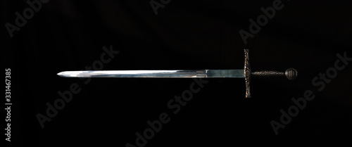 Cuadros en Lienzo medieval knight's sword on a black background