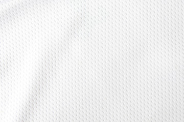 Selective focus, White mesh fabric background. cloth sport wear texture for exercise. light weight, good air flow, cool and easy to dry from sweat. abstract wallpaper with copy space for text.