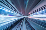 Fototapeta  - Motion blur of train moving inside tunnel with daylight in tokyo, Japan.