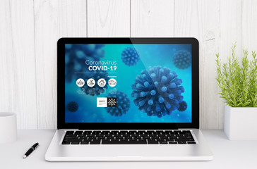 Canvas Print - laptop on table with coronavirus info website