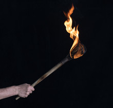 Wooden Burning Torch On A Black Background
