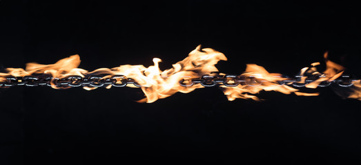 Canvas Print - iron chain on fire on a black background