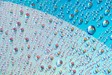 Wall Mural - water drops on dvd media, water drops on colorful background