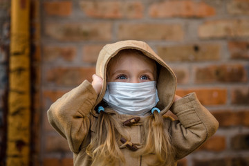 Covid-19 air and air pollution concept pm2.5. Little girl child wears a mask to protect the virus Coronavirus Covid19 virus and the symptoms of the epidemic virus.