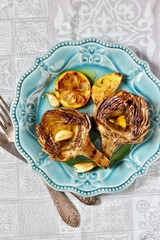 Poster - artichoke  grill. Tasty vegetables are first cooked for a couple, then fried on a grill, poured with olive oil and spices. Flatlay.  copy space. top view