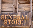Wooden General Store sign against wooden planks