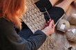 woman crocheting a natural linen pattern