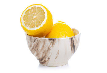 Bowl with lemons on white background isolation