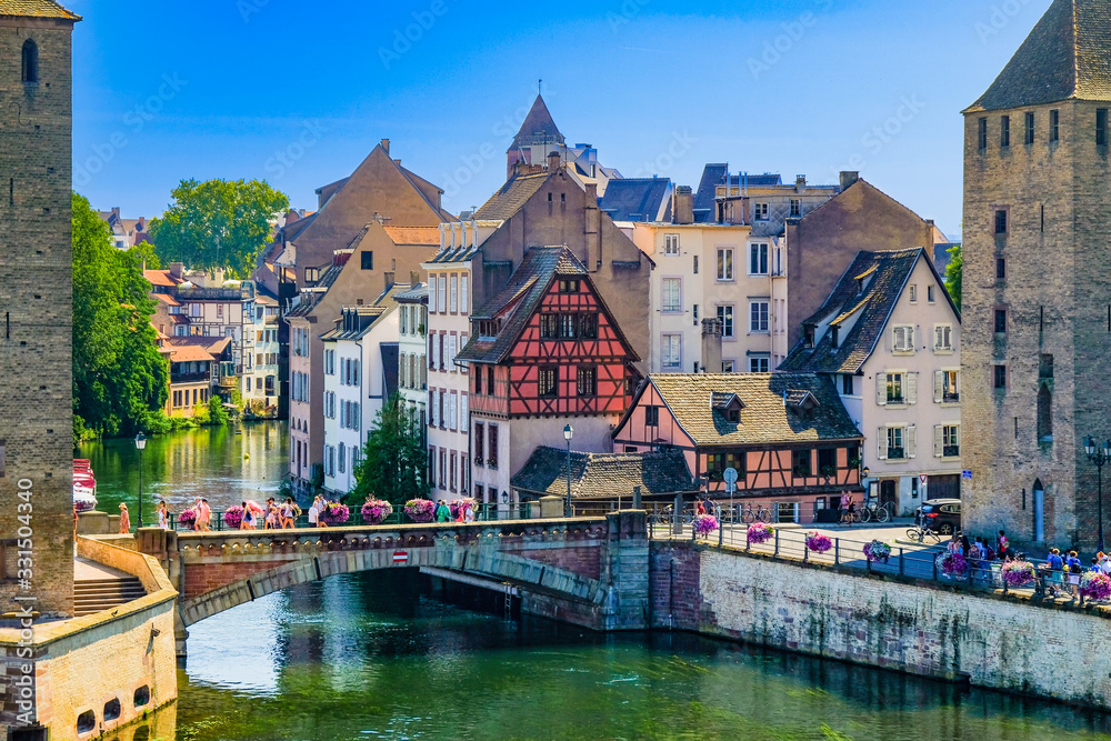 Strasbourg, France, Alsace. The Ill river and the Petite France quarter. - obrazy, fototapety, plakaty 