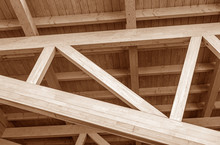 The Construction Of The Wooden Roof. Detailed Photo Of A Wooden Roof Overlap Construction.