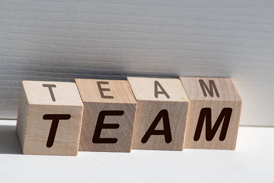 Letters that spell team. Alphabet blocks, harmonious work