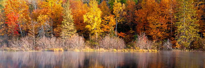 Wall Mural - A panoramic view of the fall colors along the Michigamme River in Michigan's Upper Peninsula.