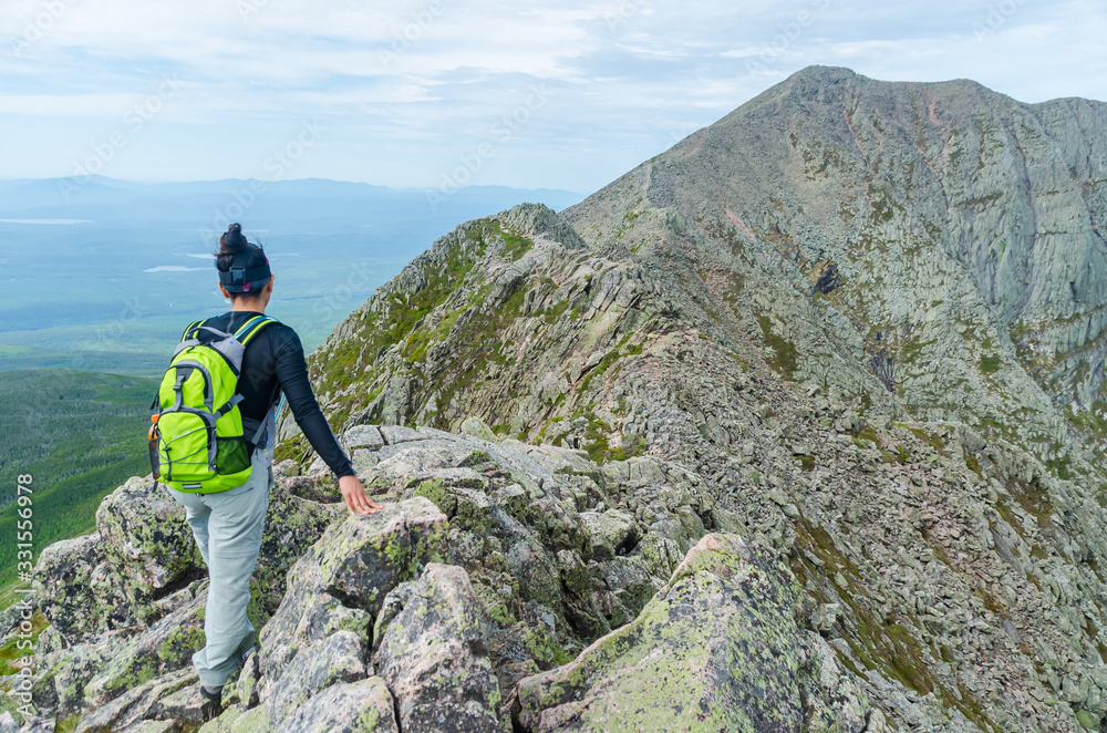 Woman hiking along Knife Edge Trail of Mount Katahdin Northeast ...
