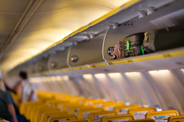 Canvas Print - Illuminated interior of airplane, holiday and travel concept, shallow DoF