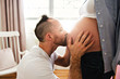 © Louis-Paul Photo - husband on the baby room at home with pregnant woman belly