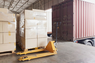 Packaging Boxes on Pallets Loading into Cargo Container. Loading Dock Shipping Trucks. Supply Chain. Shipment Boxes. Distribution Warehouse Freight Truck Transport Logistics