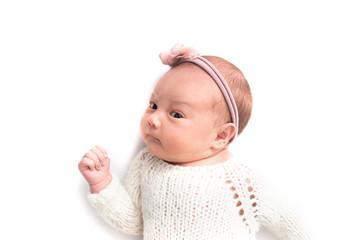 Newborn baby emotions, white background. Funny face of a child, emotions.