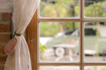 Wall Mural - Close up of transparent white lace tulle on the window. Curtain and window interior decoration in vintage style