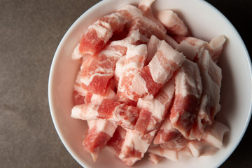 Poster - Fresh raw pork in white bowl