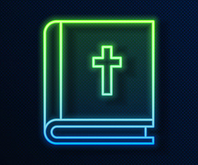 Glowing neon line Holy bible book icon isolated on blue background. Vector Illustration