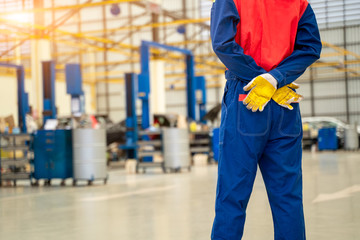 Portrait of mechanic standing in repair shop,Service concept,Repair of machines,Repair specialist,Technical maintenance.