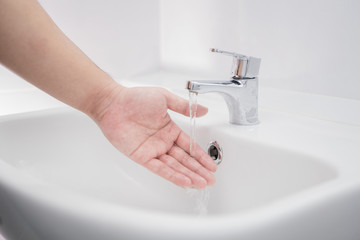 Close up man washing hands with soap cleaning water.