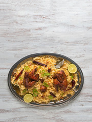 Wall Mural - Homemade chicken Biryani. Arabic traditional food bowls Kabsa with meat.