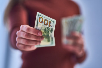 Female hands holds usd dollar bill