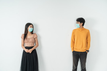 social distancing. people with masks keep their distance during virus symptoms