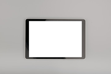 blank tablet computer on grey background