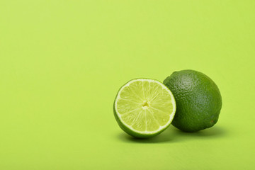 Wall Mural - Lime with slice green background