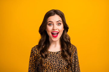 Wall Mural - Close-up portrait of her she nice-looking attractive lovely pretty amazed cheerful cheery wavy-haired girl fan good news reaction isolated on bright vivid shine vibrant yellow color background