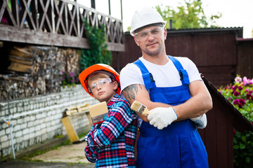 Wall Mural - Father And Son Building Tree House Together.