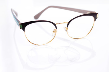 modern fashionable womens glasses for sight. frame and glass on a light background.