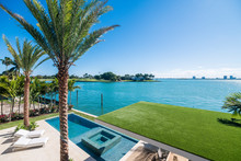 View Of A Nice Pool And Waterfront From Terrace Of A Luxury Home In Miami